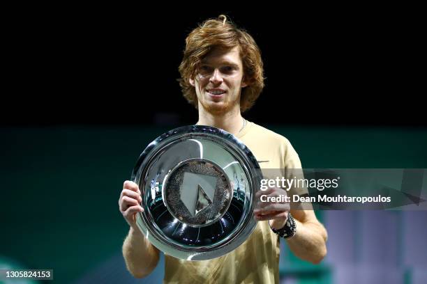 Andrey Rublev of Russia celebrates winning the Mens Final match against Marton Fucsovics of Hungary with the trophy or plate during Day 7 of the 48th...