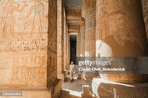 Woman walking in the ancient Egyptian temple in Luxor