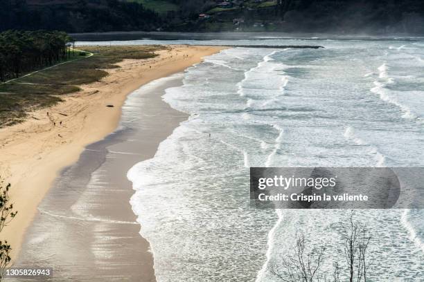 panoramic view of rodiles beach, in asturias, spain - high tide stock pictures, royalty-free photos & images