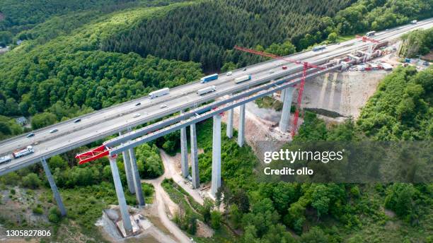 highway bridge under construction - aerial view - green bridge over trees stock pictures, royalty-free photos & images