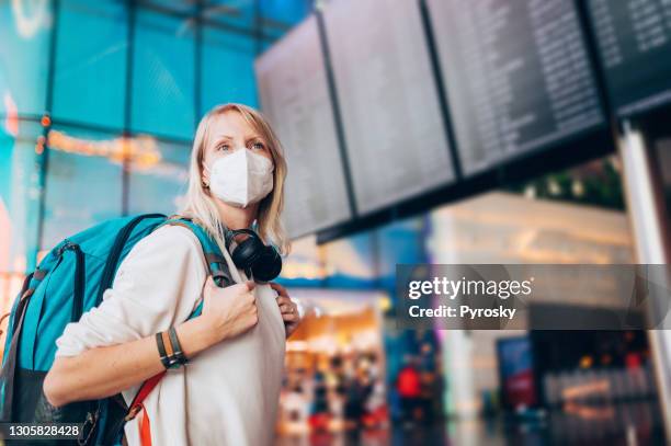 happy to travel again - airport mask stock pictures, royalty-free photos & images