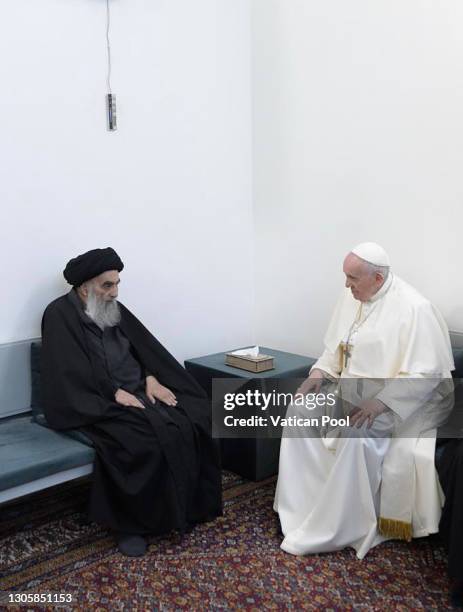 In this photograph provided by Vatican Media, Pope Francis meets with Grand Ayatollah Sayyid Ali Al-Husayni Al-Sistani on March 06, 2021 in Najaf,...
