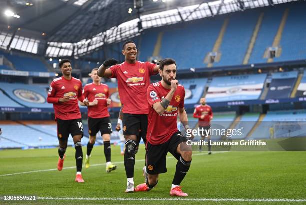 Bruno Fernandes of Manchester United celebrates scoring the first goal from a penalty during the Premier League match between Manchester City and...