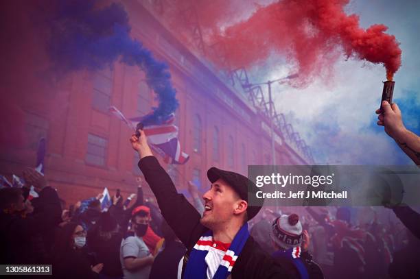 Rangers fans gather at Ibrox stadium to celebrate the club winning the Scottish Premiership for the first time in 10 years, on March 07, 2021 in...