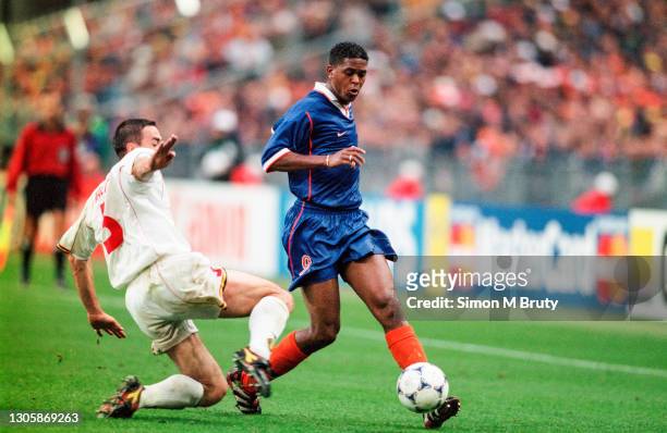 Patrick Kluivert of Holland and Lorenzo Staelens of Belgium in action during the World Cup 1st round match between Holland and Belgium at the state...
