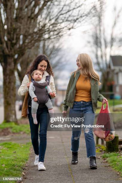 two women on walk with adorable toddler - shopping friends family stock pictures, royalty-free photos & images