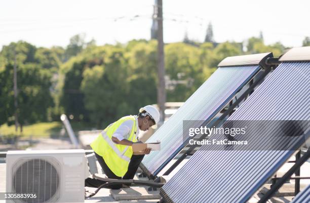 career opportunities in the solar industry - energy efficient building stock pictures, royalty-free photos & images