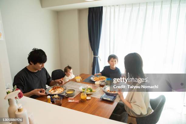 a japanese family having dinner together on a holiday - meal ストックフォトと画像