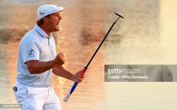 Bryson DeChambeau of the United States celebrates making his putt on the 18th green to win during the final round of the Arnold Palmer Invitational...