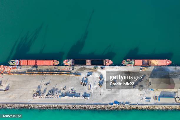 drone point view of cargo ship in the port. - iron ore stock pictures, royalty-free photos & images