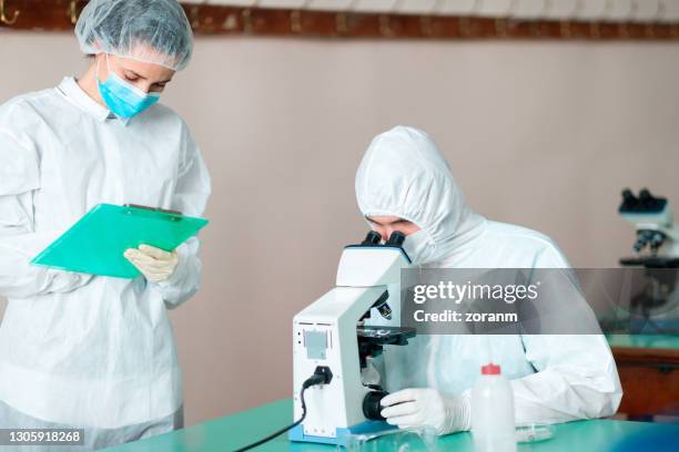 64 Scientist Looking Down Microscope Stock Photos, High-Res Pictures ...