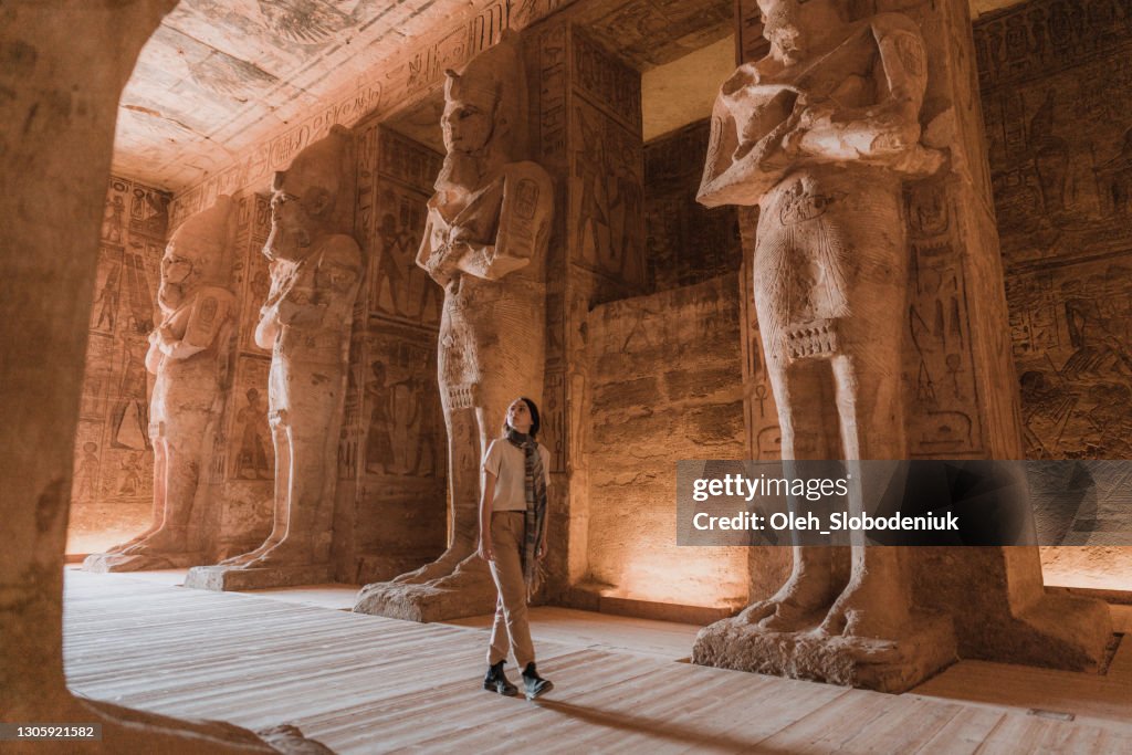Woman walking inside Abu Simbel temples