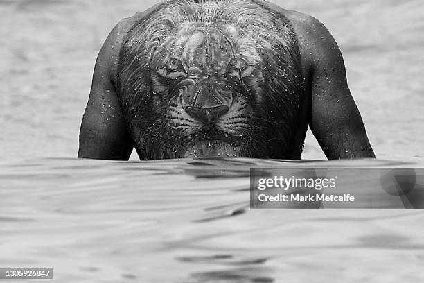 The tattoo of James Bell of the Swans is seen during a Sydney Swans AFL recovery session at Bondi Beach on March 08, 2021 in Sydney, Australia.