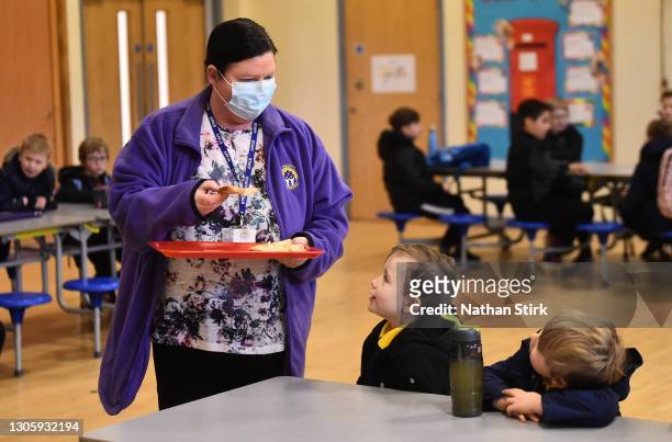Children attend breakfast club at St Mary’s CE Primary School on March 08, 2021 in Stoke on Trent, England.England's schools re-open to pupils from...