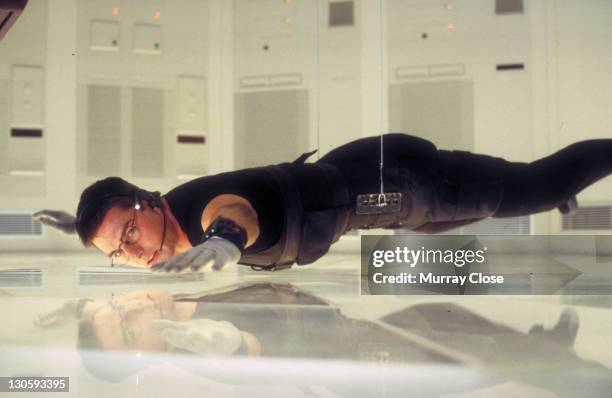 American actor Tom Cruise as Ethan Hunt in a scene from the film 'Mission: Impossible', 1996. Here he steals the NOC list from the CIA headquarters...
