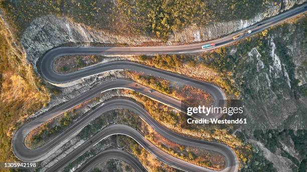 aerial view of the winding road, serra de leba, angola - angola drone stock pictures, royalty-free photos & images