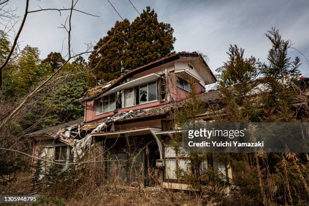 An abandoned house is seen inside the "difficult-to-return" zone on March 08, 2021 in Namie, Japan. In ceremonies that are expected to be scaled back...