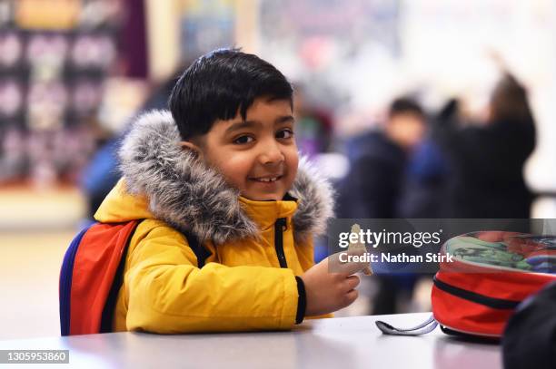 Child attends breakfast club at St Mary’s CE Primary School on March 08, 2021 in Stoke on Trent, England. Schools in England welcome pupils back...