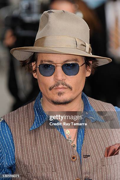 Actor Johnny Depp enters the "Late Show With David Letterman" taping at the Ed Sullivan Theater on October 26, 2011 in New York City.