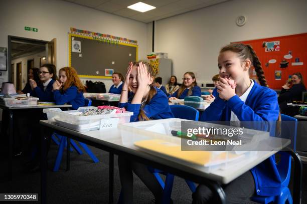 Pupils react during a coordination game, as classes return to Gamlingay Village Primary on March 08, 2021 near Bedford, United Kingdom. The school,...