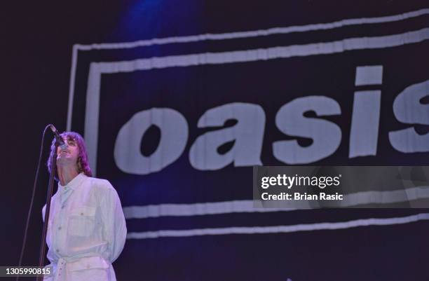 Singer Liam Gallagher performing with British rock group, Oasis, at Knebworth House, Hertfordshire, 10th August 1996.