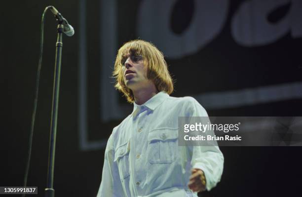 Singer Liam Gallagher performing with British rock group, Oasis, at Knebworth House, Hertfordshire, 10th August 1996.