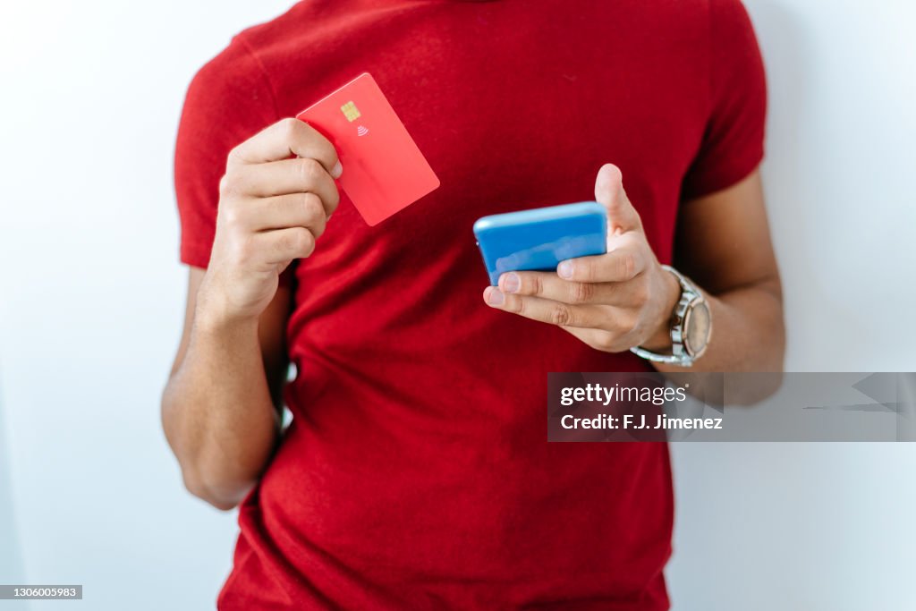 Man Is Using Creadit Card Man Using Credit Card And Smartphone High-Res Stock Photo - Getty Images
