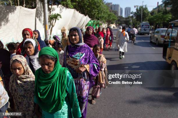 People attend the Aurat March for International Women's Day on March 08, 2021 in Karachi, Pakistan. An end to gender-based violence, sexual...