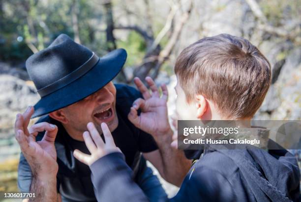 father spending a great time in nature with his son. - ok sign stock pictures, royalty-free photos & images