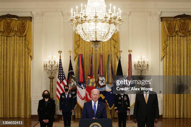 President Joe Biden delivers remarks on International Women’s Day as Vice President Kamala Harris, Air Force General Jacqueline Van Ovost, Army...