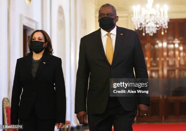 Vice President Kamala Harris and Secretary of Defense Lloyd Austin enter the East Room of the White House to attend an announcement March 8, 2021 in...