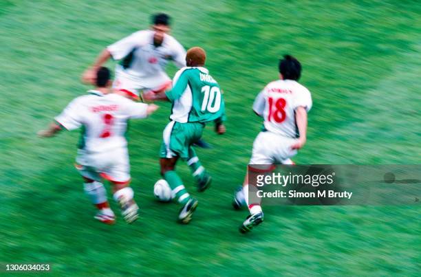 Jay Jay Okocha of Nigeria in action during the World Cup 1st round match between Nigeria and Bulgaria at the Parc des Princes, France on June 19,...