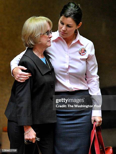 Phyllis Murray mother of Luluemon employee Jayna Murray is hugged by as they waited for other family members to clear the security station at the...