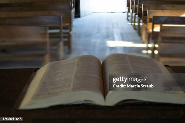bible on the pulpit of an old country chirch - pulpit stock pictures, royalty-free photos & images