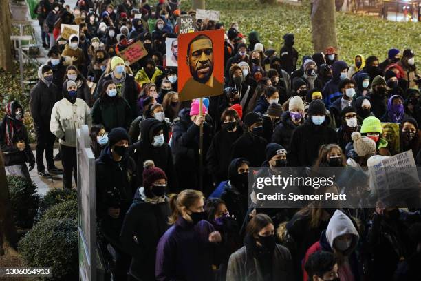 People gather in a Manhattan park to protest on the first day of the trial for the killing of George Floyd last May on March 08, 2021 in New York...