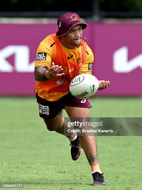 Issac Luke passes the ball during a Brisbane Broncos NRL training session at Clive Berghofer Field on March 09, 2021 in Brisbane, Australia.