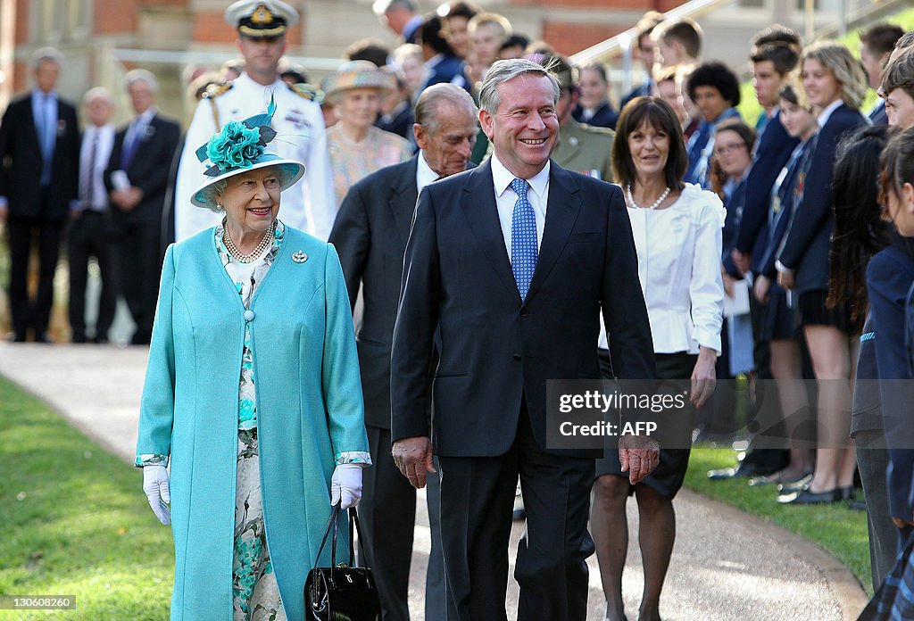 Britain's Queen Elizabeth II (L) walks p