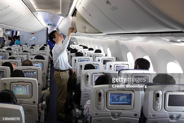 The economy class cabin of a Boeing Co. 787 Dreamliner for All Nippon Airways Co. Is seen in Narita City, Chiba Prefecture, Japan, on Wednesday, Oct....