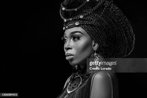 headshot portrait of a beautiful african queen wearing a headdress - black royalty stock pictures, royalty-free photos & images