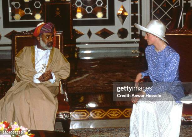 Diana, Princess of Wales, wearing a blue and white outfit designed by Catherine Walker and a white hat, speaks to Sultan Qaboos bin Said al Said of...