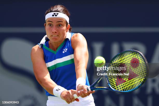 Anastasija Sevastova of Latvia plays a backhand in her Round Two match against Karolina Pliskova of The Czech Republic during Day Three of the Dubai...