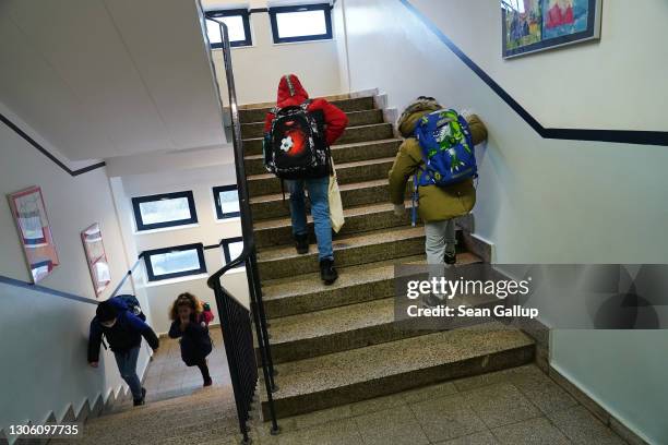 Children arrive for in-person classes at the GutsMuths elementary school during the coronavirus pandemic on March 09, 2021 in Berlin, Germany. As of...