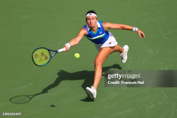 Anastasija Sevastova of Latvia stretches to play a forehand in her Round Two match against Karolina Pliskova of The Czech Republic during Day Three...