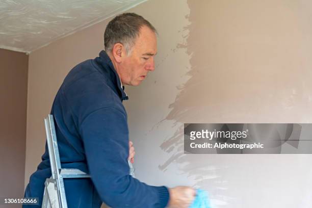 senior man cleaning old paintwork - january 2021 stock pictures, royalty-free photos & images