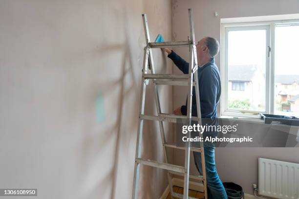 senior man cleaning old paintwork - january 2021 stock pictures, royalty-free photos & images