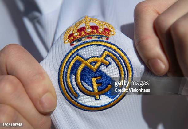 Displaying the Real Madrid club crest on the first team home shirt on March 7, 2021 in Manchester, United Kingdom.