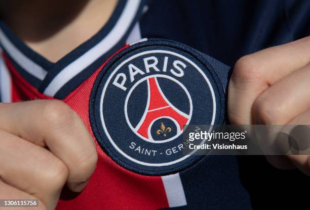 Displaying the Paris Saint-Germain club crest on the first team home shirt on March 7, 2021 in Manchester, United Kingdom.