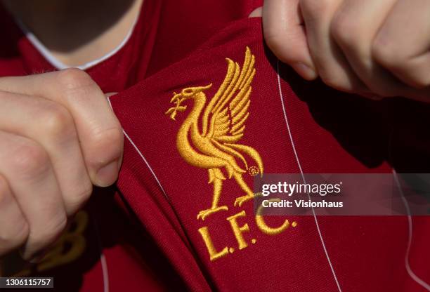 Displaying the Liverpool club crest on the first team home shirt on March 7, 2021 in Manchester, United Kingdom.
