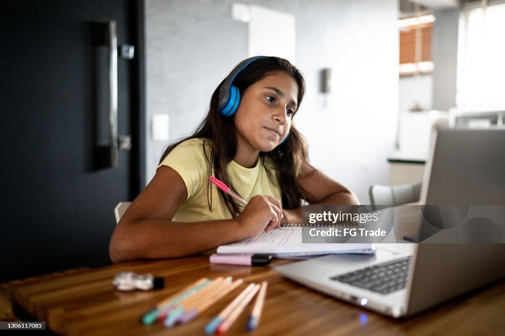 Teenager girl on homeschooling activity