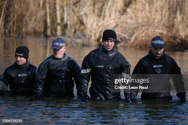 Police search teams work their way through Mount Pond on Clapham Common as the hunt for missing woman Sarah Everard enters its fifth day, on March...